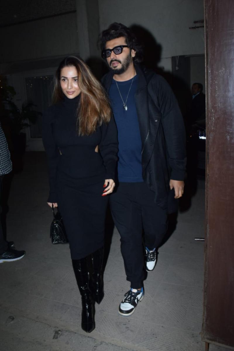 The hottest couple in B-town, Arjun Kapoor and Malaika Arora made a stylish entry as they arrived at Varun's party together. While Malaika stunned in her chic black pullover dress, Arjun looked uber cool in his stylish black overcoat and black joggers. 